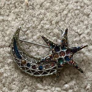 Shooting star broach.